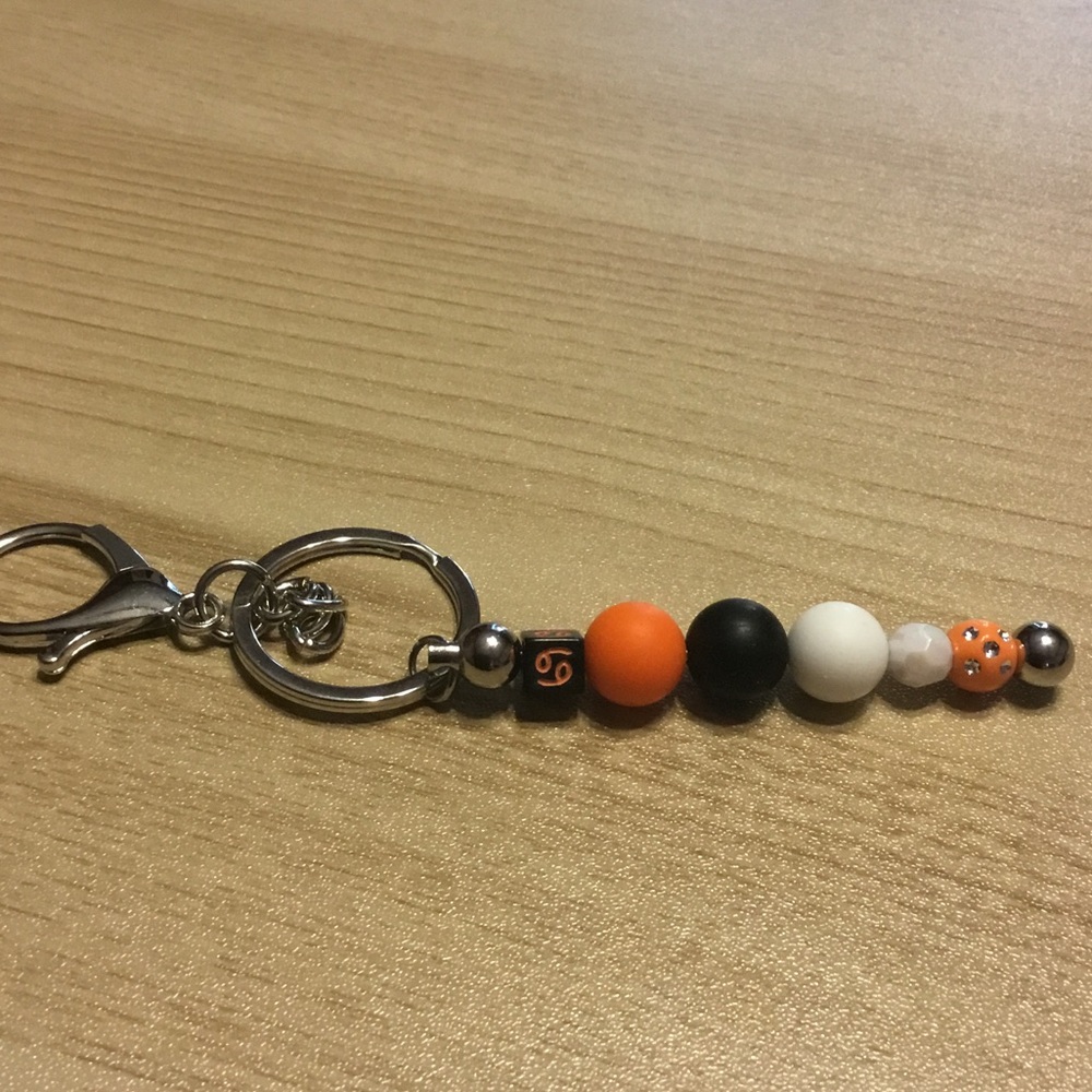 Beaded Keychain with Orange and Black Accents